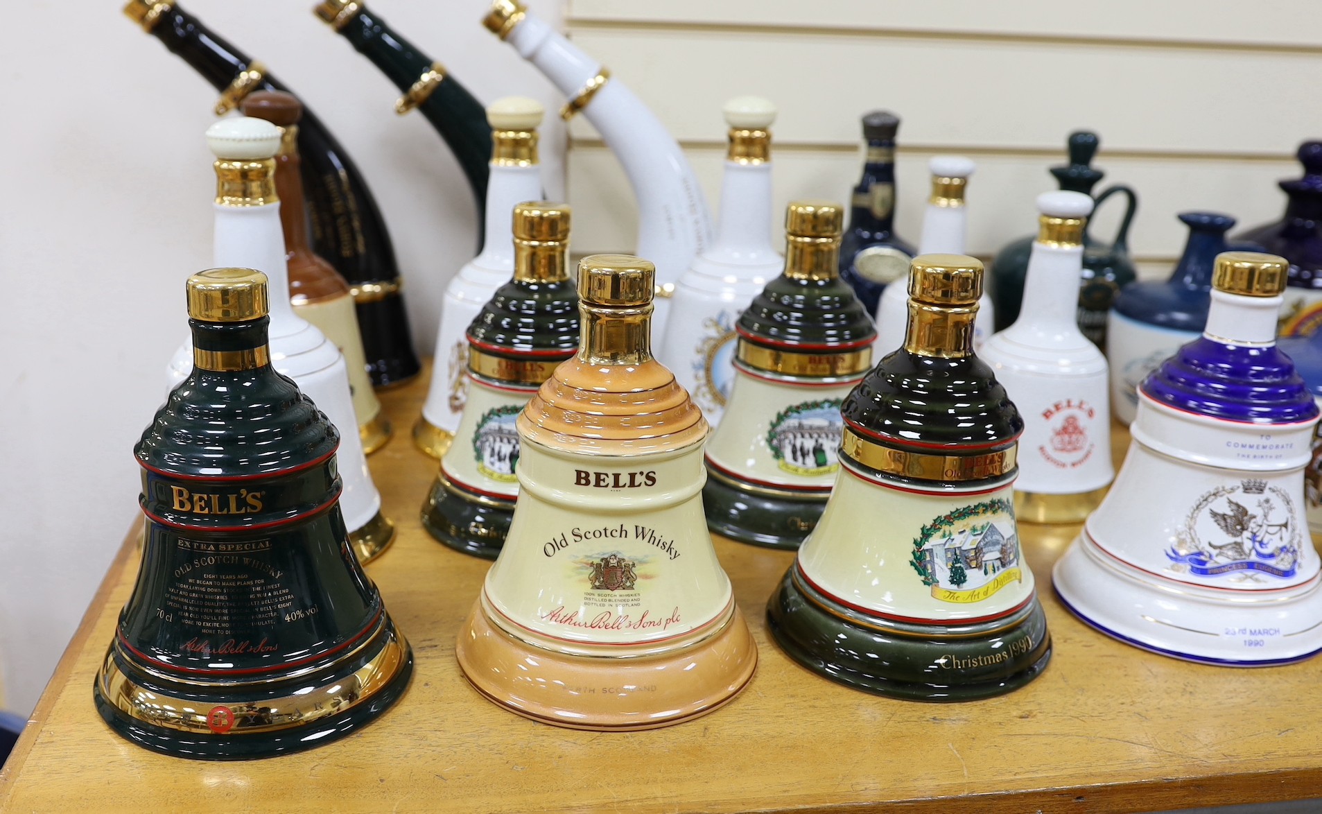 Four Wade commemorative porcelain 70cl bottles of Bells whisky, a miniature porcelain bottle of bells whisky, two miniature ‘beer pump’ bottles of mead and a large quantity of empty porcelain decanters